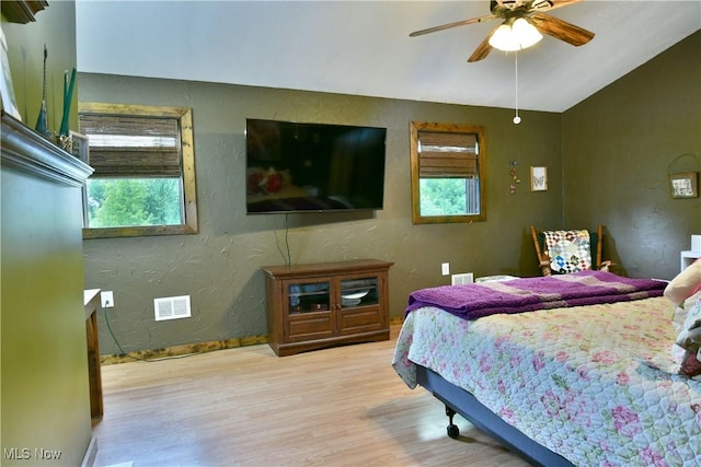 6416 Wilson Sharpsville Rd, Fowler, OH 44418 - bedroom with wood finished floors, lofted ceiling, baseboards, a textured wall, and a ceiling fan
