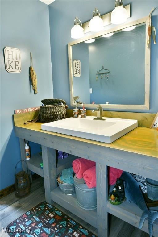 6416 Wilson Sharpsville Rd, Fowler, OH 44418 - bathroom featuring wood finished floors and vanity