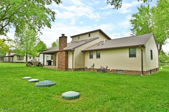 6416 Wilson Sharpsville Rd, Fowler, OH 44418 - rear view of house featuring cooling unit, a yard, a chimney, and a shingled roof