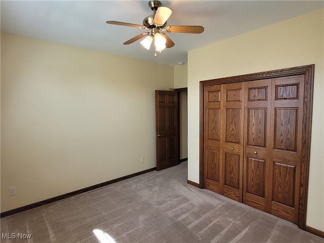 3172 Kinata Ct, West Salem, OH 44287 - unfurnished bedroom featuring carpet floors, baseboards, a closet, and a ceiling fan