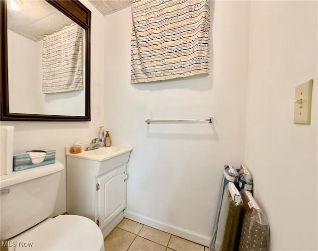 2007 Washington Blvd, Belpre, OH 45714 - half bathroom with toilet, vanity, tile patterned flooring, and baseboards