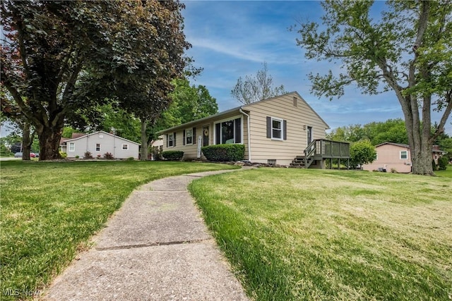 715 Locust St S, Canal Fulton, OH 44614 - single story home featuring a front yard and a wooden deck
