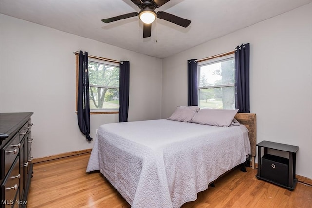 715 Locust St S, Canal Fulton, OH 44614 - bedroom with light wood-style flooring, baseboards, and a ceiling fan