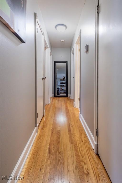 715 Locust St S, Canal Fulton, OH 44614 - corridor with light wood-style flooring and baseboards
