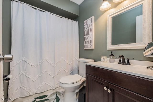 715 Locust St S, Canal Fulton, OH 44614 - bathroom with vanity, toilet, a shower with shower curtain, and tile patterned floors