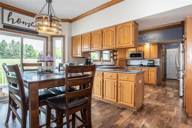 18230 James Way, Doylestown, OH 44230 - kitchen with stainless steel appliances, ornamental molding, a chandelier, a sink, and plenty of natural light