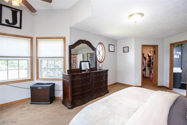 18230 James Way, Doylestown, OH 44230 - bedroom featuring carpet, baseboards, a spacious closet, a ceiling fan, and a closet