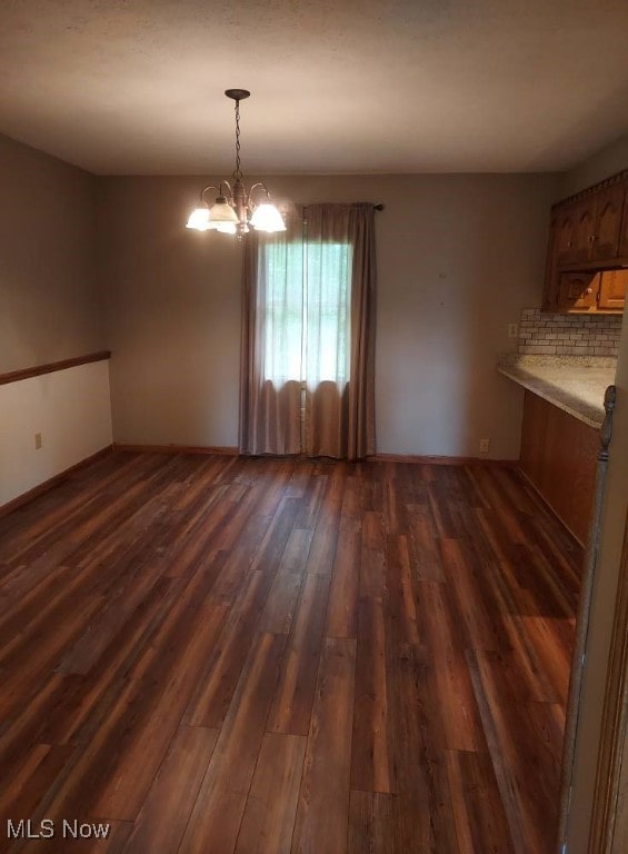 130 Maze Rd, Belpre, OH 45714 - unfurnished dining area with dark wood finished floors and a chandelier