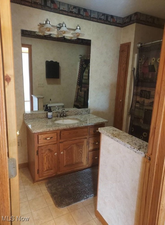 130 Maze Rd, Belpre, OH 45714 - full bathroom with vanity, tile patterned flooring, and a shower