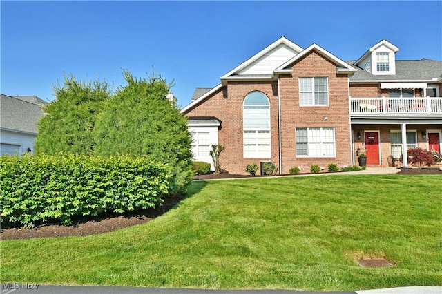 100 Turnberry Ct NE, Warren, OH 44484 - view of front of home featuring brick siding and a front lawn