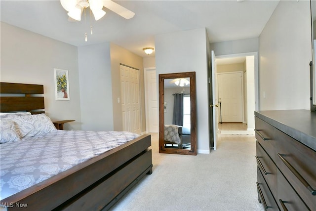 100 Turnberry Ct NE, Warren, OH 44484 - bedroom featuring light carpet, a closet, baseboards, and a ceiling fan