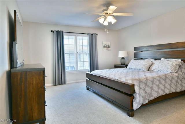 100 Turnberry Ct NE, Warren, OH 44484 - bedroom featuring light carpet, baseboards, and a ceiling fan