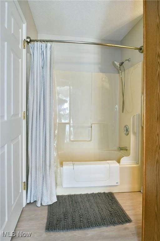 100 Turnberry Ct NE, Warren, OH 44484 - full bathroom featuring shower / bath combination with curtain and wood finished floors