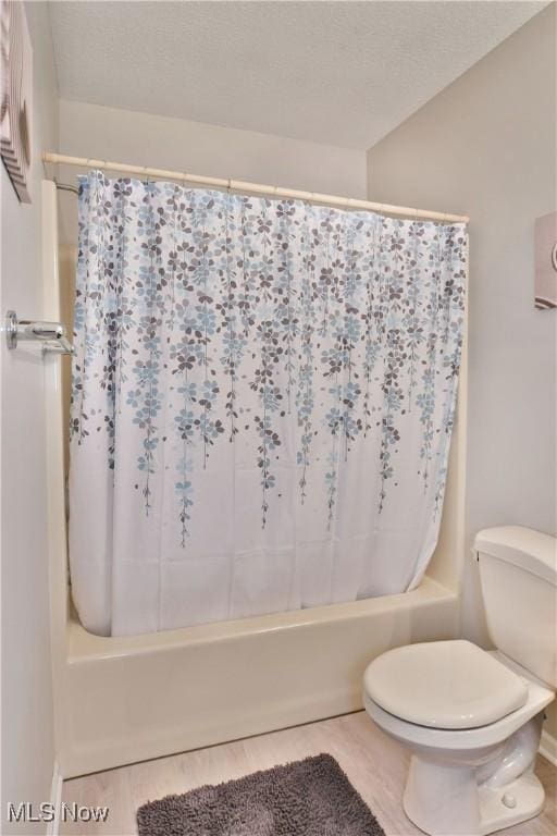 100 Turnberry Ct NE, Warren, OH 44484 - bathroom with shower / tub combo with curtain and toilet