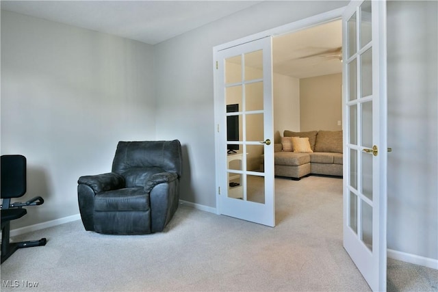100 Turnberry Ct NE, Warren, OH 44484 - sitting room featuring french doors, carpet flooring, and baseboards