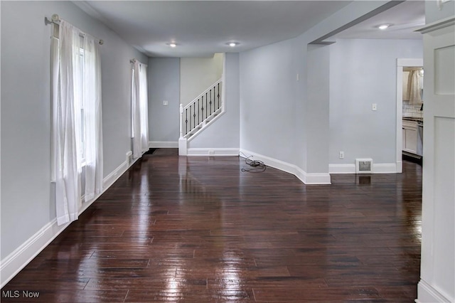2577 Idlewood Rd, Cleveland Heights, OH 44118 - empty room with stairway, hardwood / wood-style floors, and baseboards