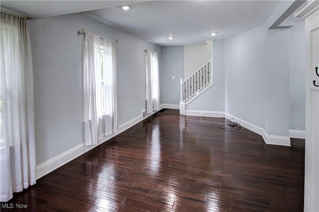 2577 Idlewood Rd, Cleveland Heights, OH 44118 - spare room with stairs, wood-type flooring, baseboards, and recessed lighting