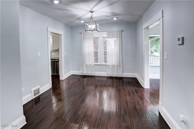 2577 Idlewood Rd, Cleveland Heights, OH 44118 - unfurnished dining area featuring dark wood-type flooring and baseboards