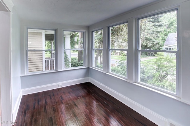 2577 Idlewood Rd, Cleveland Heights, OH 44118 - unfurnished sunroom featuring baseboards, healthy amount of natural light, and hardwood / wood-style floors