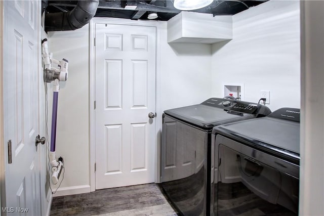 2577 Idlewood Rd, Cleveland Heights, OH 44118 - washroom featuring washing machine and dryer, wood finished floors, and baseboards