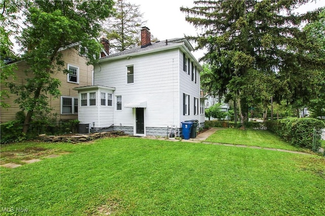 2577 Idlewood Rd, Cleveland Heights, OH 44118 - back of house with a chimney