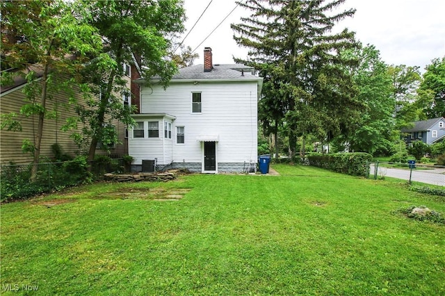 2577 Idlewood Rd, Cleveland Heights, OH 44118 - rear view of house featuring a chimney and cooling unit
