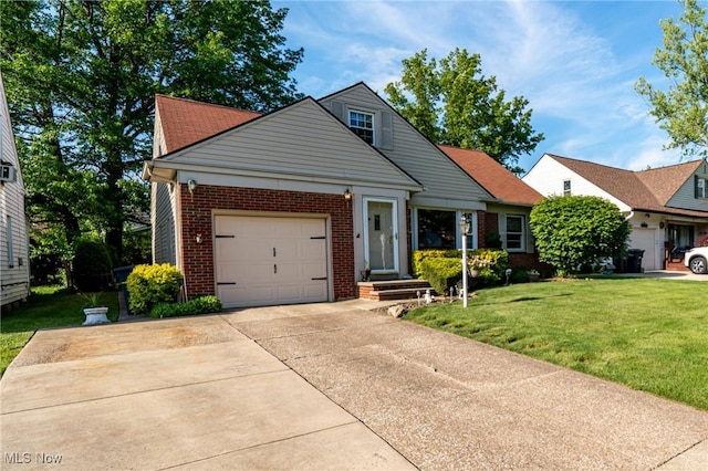 23903 E Baintree Rd, Beachwood, OH 44122 - view of front of property with brick siding, a garage, a front lawn, and concrete driveway
