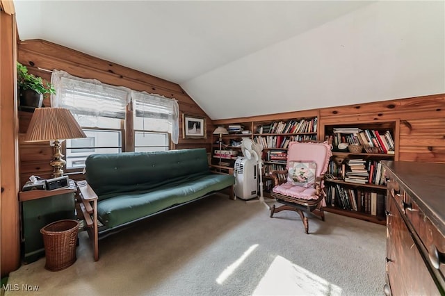 23903 E Baintree Rd, Beachwood, OH 44122 - living area with vaulted ceiling, carpet flooring, and wooden walls