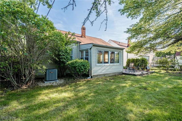 23903 E Baintree Rd, Beachwood, OH 44122 - back of property with a chimney and central AC