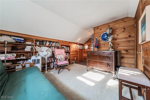 23903 E Baintree Rd, Beachwood, OH 44122 - living area featuring wood walls, vaulted ceiling, and carpet flooring