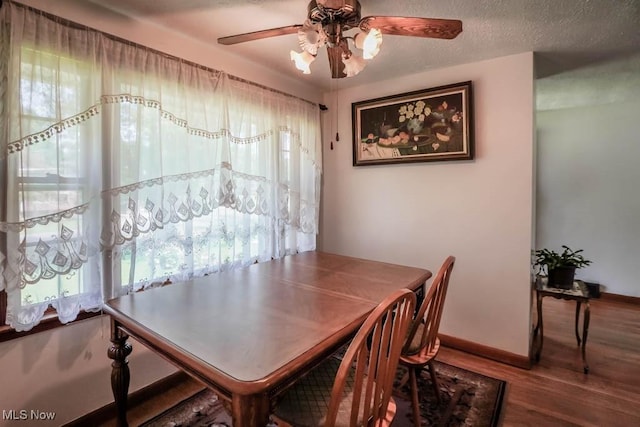 5920 Renninger Rd, New Franklin, OH 44319 - dining area featuring wood finished floors, a ceiling fan, and baseboards