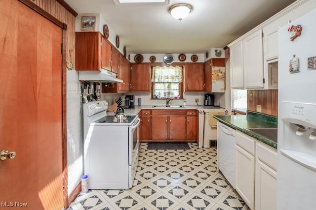 5920 Renninger Rd, New Franklin, OH 44319 - kitchen with white appliances, a sink, under cabinet range hood, white cabinets, and brown cabinetry