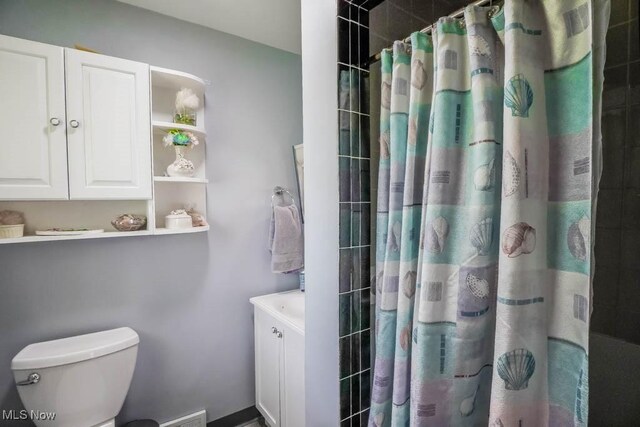 5920 Renninger Rd, New Franklin, OH 44319 - bathroom featuring toilet, vanity, and a shower with curtain