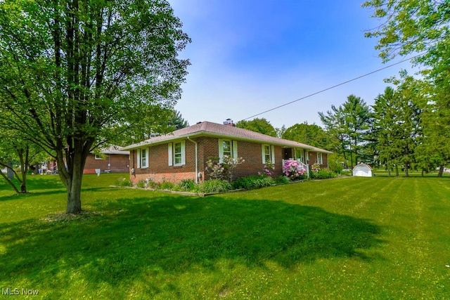 5920 Renninger Rd, New Franklin, OH 44319 - view of front of house with brick siding, a front lawn, and a chimney