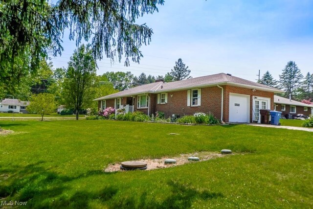 5920 Renninger Rd, New Franklin, OH 44319 - ranch-style home featuring an attached garage, brick siding, and a front yard