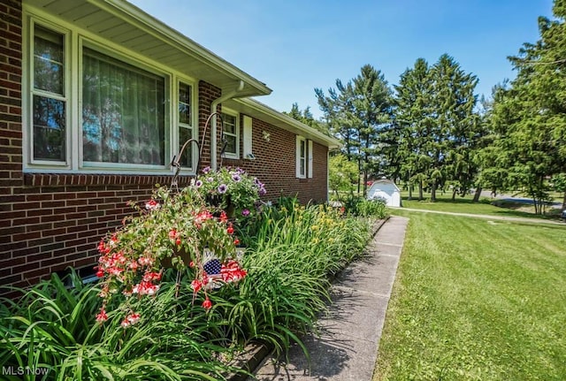 5920 Renninger Rd, New Franklin, OH 44319 - view of property exterior featuring a yard and brick siding