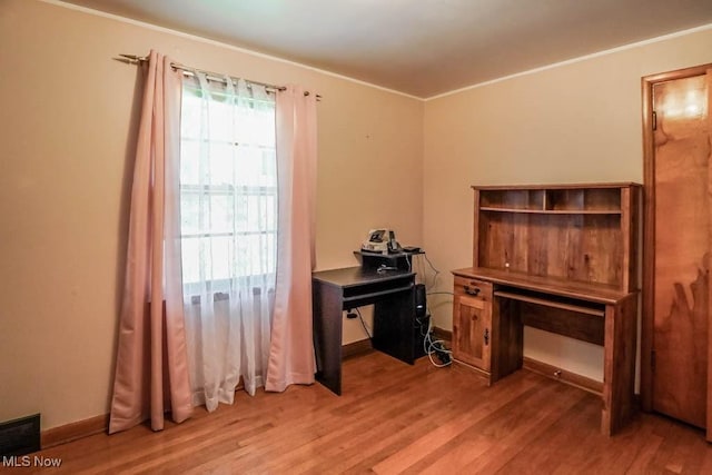 5920 Renninger Rd, New Franklin, OH 44319 - office area featuring light wood-type flooring, crown molding, and baseboards