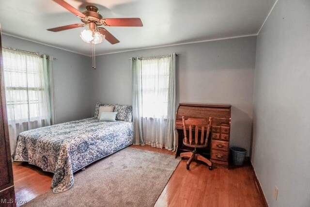 5920 Renninger Rd, New Franklin, OH 44319 - bedroom featuring wood finished floors, crown molding, and ceiling fan