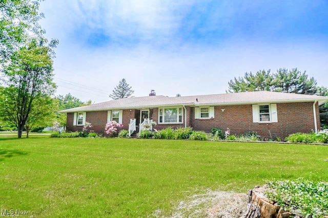 5920 Renninger Rd, New Franklin, OH 44319 - ranch-style house featuring brick siding, a chimney, and a front yard