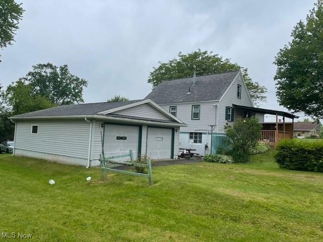 2410 Perry Dr SW, Canton, OH 44706 - back of house featuring a yard and driveway