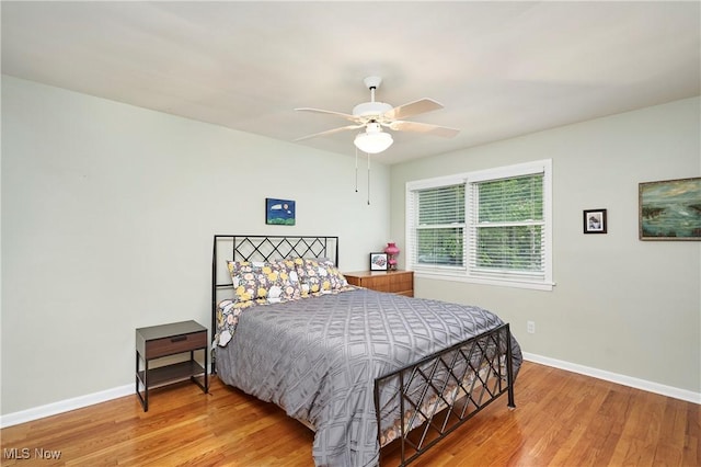 4418 Temblett Ter, South Euclid, OH 44121 - bedroom featuring baseboards, wood finished floors, and a ceiling fan