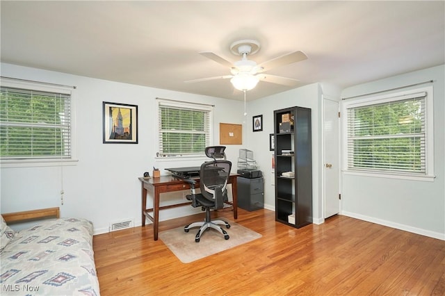 4418 Temblett Ter, South Euclid, OH 44121 - office area featuring healthy amount of natural light, a ceiling fan, light wood-type flooring, and baseboards