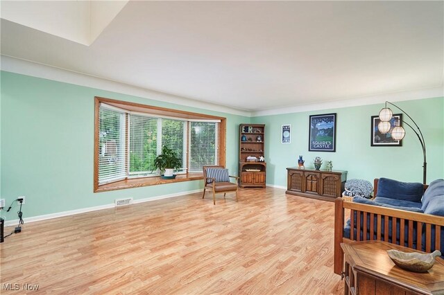 4418 Temblett Ter, South Euclid, OH 44121 - sitting room featuring light wood-type flooring, baseboards, and ornamental molding