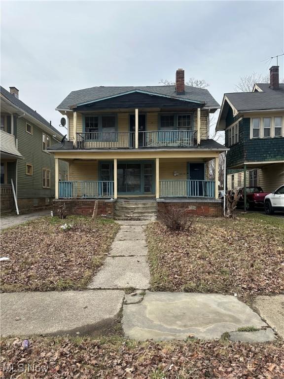 1544 Belmar Rd, East Cleveland, OH 44118 - view of front of home featuring a porch, a balcony, and a chimney