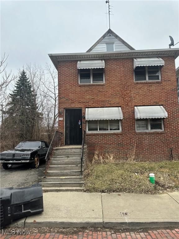 735 E 165th St, Cleveland, OH 44110 - view of front facade with brick siding