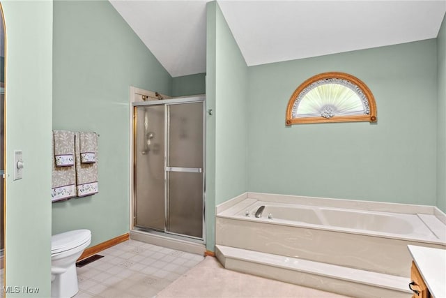 5011 Buttonbush Ln, North Royalton, OH 44133 - bathroom with toilet, a bath, a shower stall, tile patterned floors, and lofted ceiling