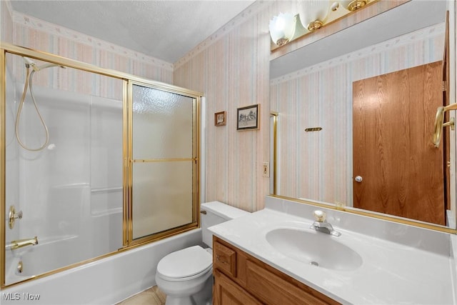 5011 Buttonbush Ln, North Royalton, OH 44133 - full bathroom featuring wallpapered walls, vanity, toilet, bath / shower combo with glass door, and a textured ceiling