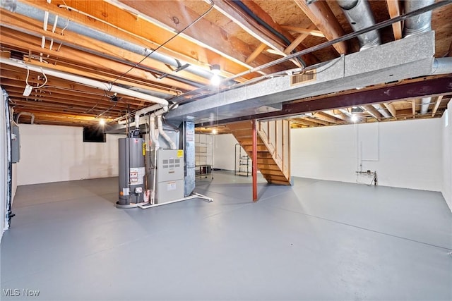 5011 Buttonbush Ln, North Royalton, OH 44133 - unfinished basement featuring water heater, stairs, and heating unit
