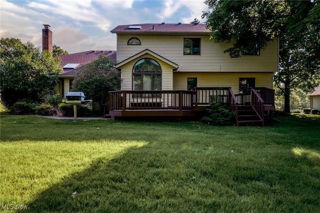 5011 Buttonbush Ln, North Royalton, OH 44133 - back of property with a wooden deck and a yard
