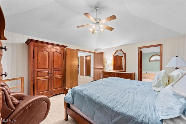 5011 Buttonbush Ln, North Royalton, OH 44133 - bedroom with light colored carpet, lofted ceiling, wallpapered walls, ceiling fan, and ensuite bath